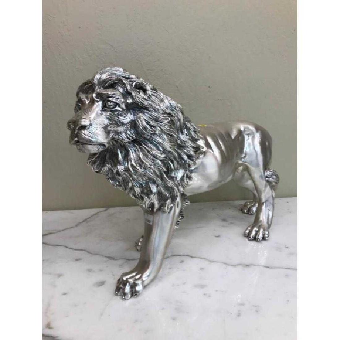 Silver Leaf Bronze Lion Statue, Signed: Bronze lion statue with silver leaf. Signed. In good condition, from a private collection. Measures approx. 15"h x 24"W x 8"D.