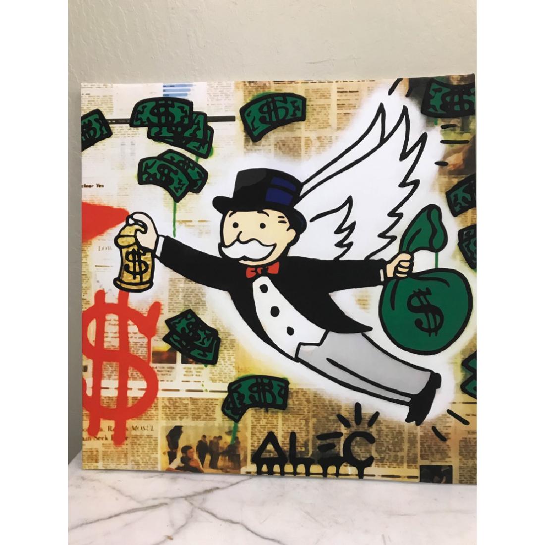 Print on Canvas of Monopoly Man Angel: An Alec Monopoly reproduction, print on canvas of Monopoly man with wings holding a bag of money and spray paint. Unframed, measures approx. 23.5"H x 23.5"W. In good condition, from a local estate.