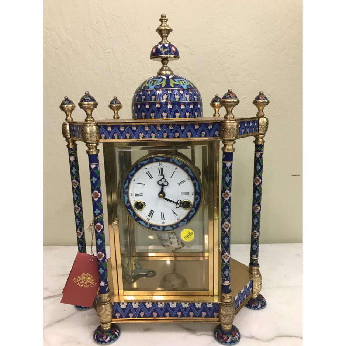 Antique Cloisonne Clock: Antique cloisonne clock with roman numeral face. Makes hourly sound. Manual winding. In good condition, from a local estate. Measures approx. 18"H x 25"W x 8"D.