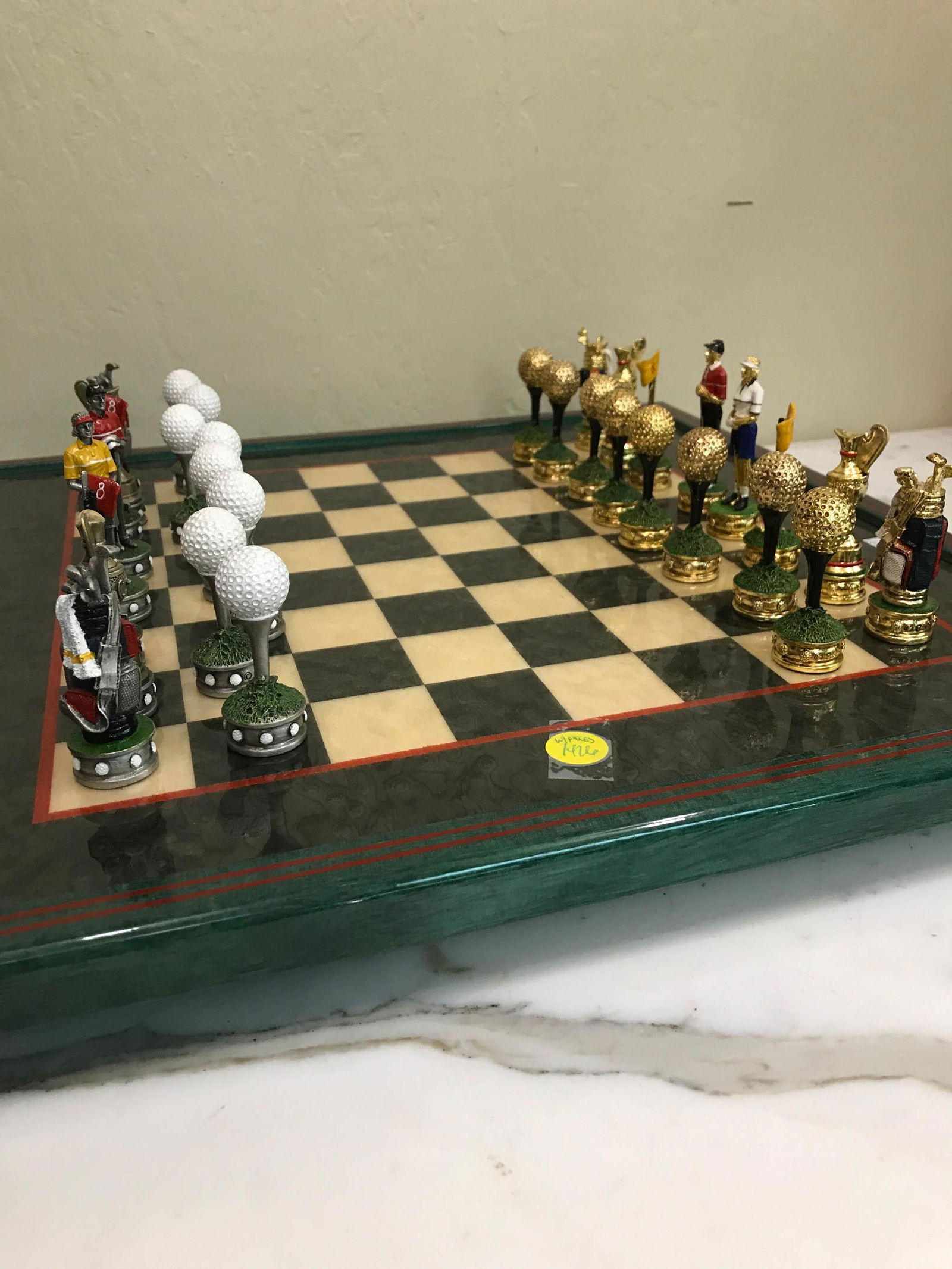 Italian 24k, Silver Chess Set, Golf Team: Magnificent chess set with golf team with both 24k gold leaf and silver plated bronze game pieces with brightly colored enameled accents. Pieces has black felt on the bottom. Game board is lacquered w