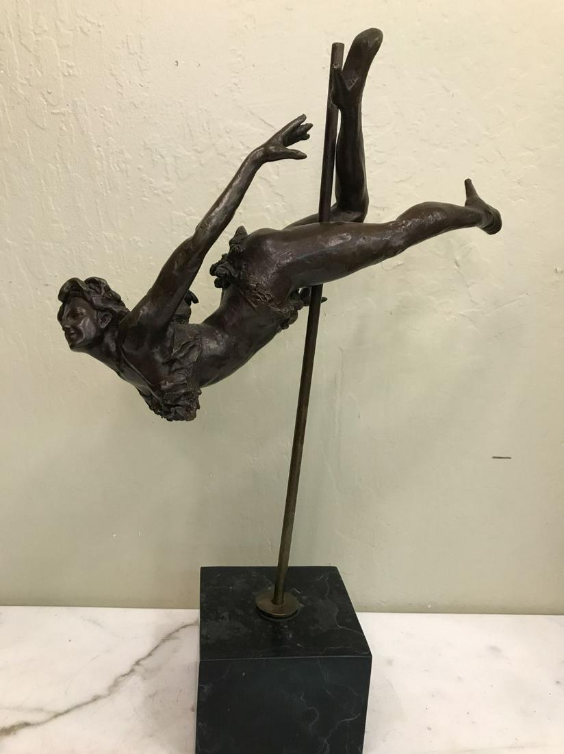 Bronze Statue of a Pole Dancer: Unique bronze statue of a pole dancer with good details. Mounted on a black marble base. In good condition. Measures approx. 19.5"H x 13"W x 5"D.