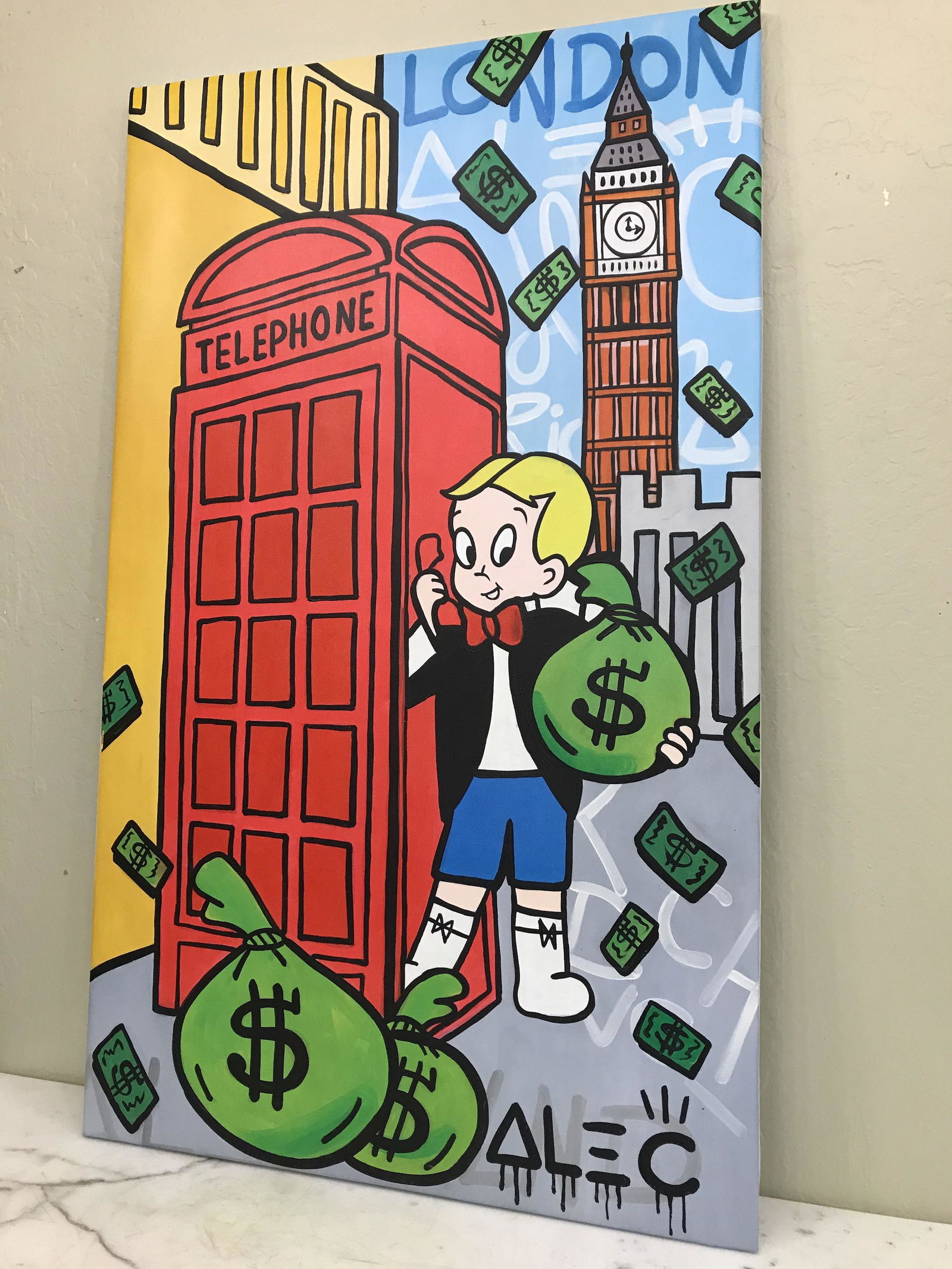 Large Oil on Canvas, Alec Monopoly Reproduction: Large Oil on Canvas, Alec Monopoly Reproduction Boy in Phone Booth, London Setting Local Estate Private Collector Condition: Good Deminsions: 40" x 24"