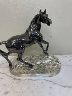 Hematite and Silver Plated Horse Statue: Unique Italian statue of a hematite horse standing on a silver plated bronze base with excellent detail. In good condition. Measures approx. 14"H x 13.5"W x 7.5"D.