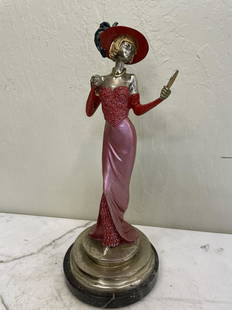 Art Deco Patinated Bronze Statue - Woman: Art deco bronze statue of a woman holding a mirror. Multi-patinated. Mounted on a marble base. In good condition. Measures approx. 16"H x 6.5" diameter at the base.