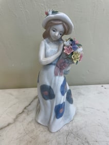 Porcelain Girl Holding Flowers