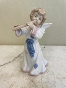Porcelain Cherubs Playing Flute Figurine