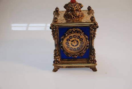 Continental Carriage Clock with Reuge Music Box.: Continental carriage clock with Reuge music box. Ornate gilt metal and enameled case set with semi- precious stones including pearls measuring approximately 3.4 mm round and amethyst ranging in size f