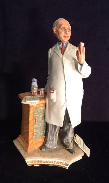 Capodimonte Porcelain Statue of Pharmacist: A porcelain Capodimonte statue with great details with marking. Measures approximately 13.5" H x 6" W x 5.5" D