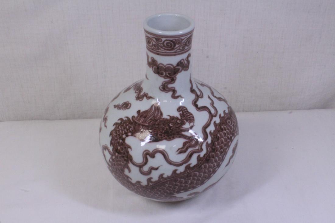 A red and white glazed bottle vase (1 of 10)