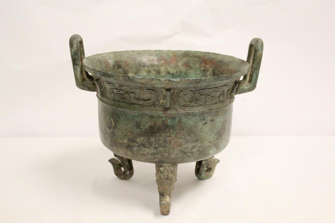 A large Chinese archaic style bronze tripod ding (1 of 10)