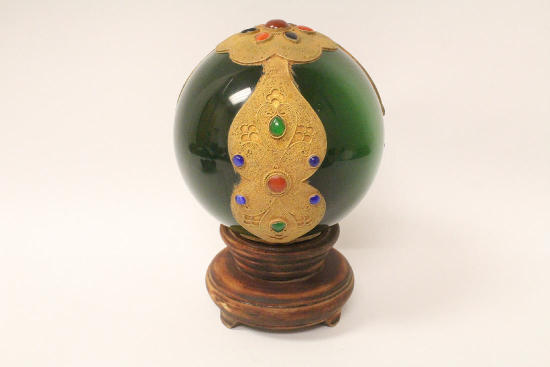 A crystal ball with metal overlay, set with jewels (1 of 10)