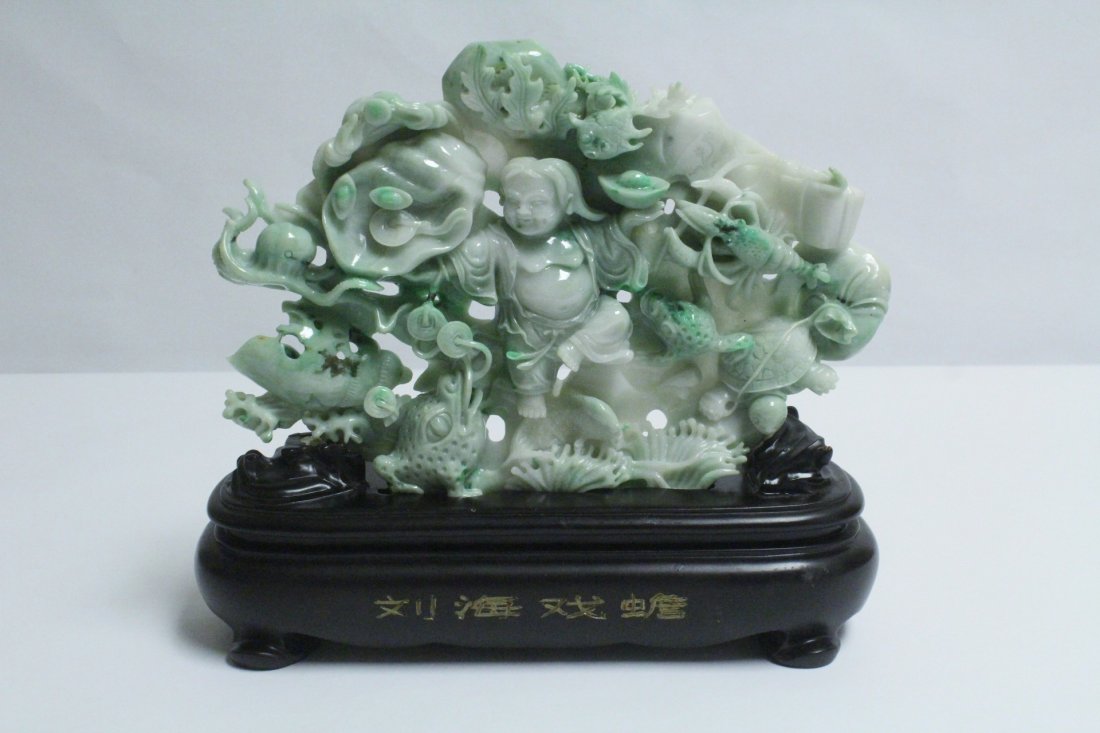 A magnificent apple green jadeite carving with stand (1 of 10)