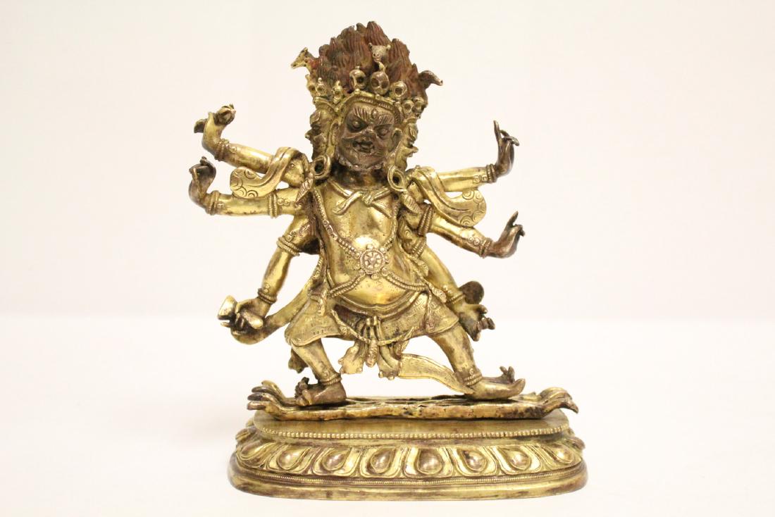An important antique Tibetan gilt bronze deity (1 of 10)