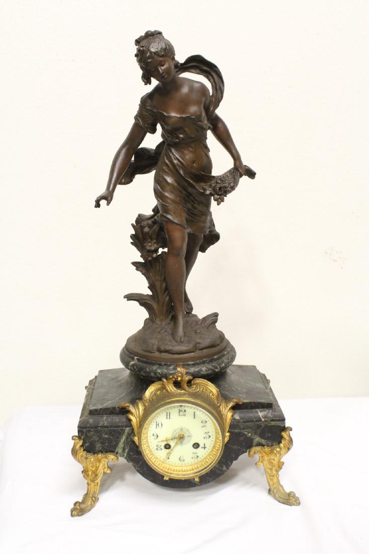 French antique clock with painted metal sculpture
