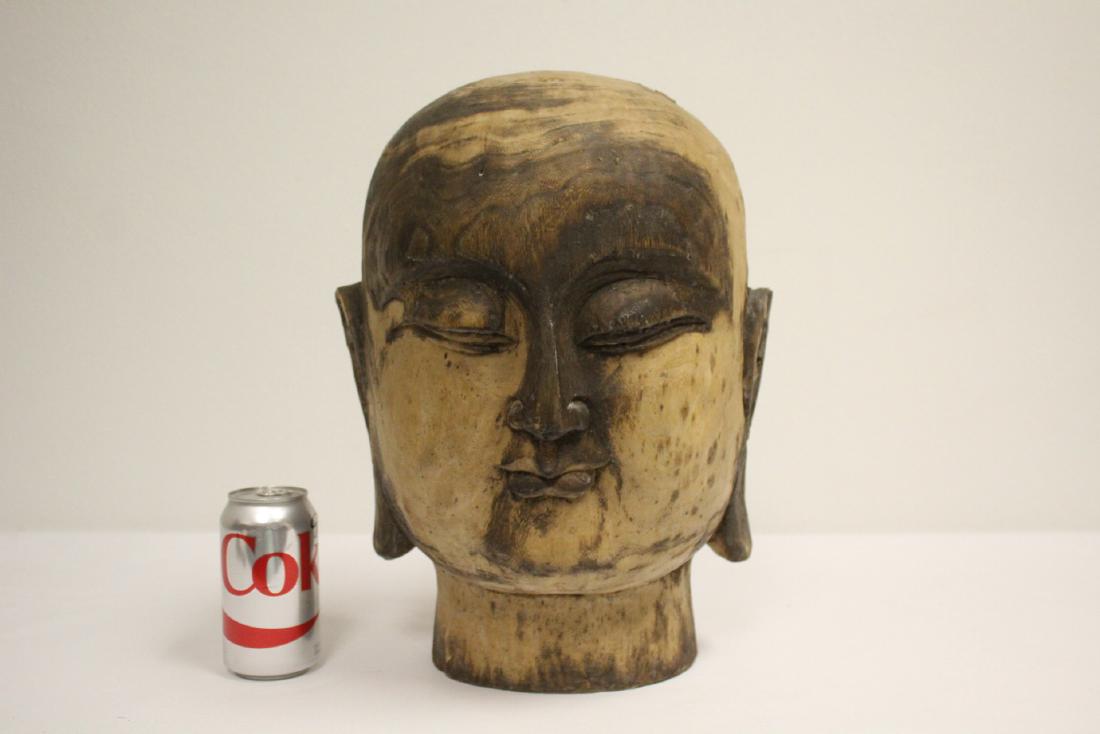 A large wood carved Buddha head (1 of 10)