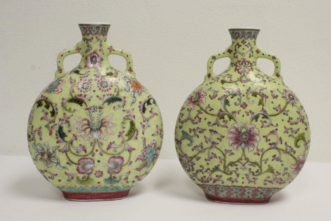 Pair Chinese famille rose porcelain wine flasks: Pair Chinese famille rose porcelain wine flasks (one has repair on top, 9.95"Hx7.65"x3.5" each)