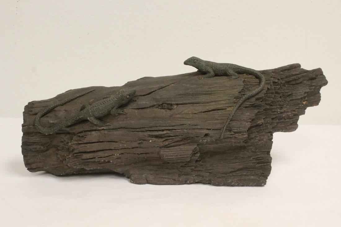 A fossil wood(?) fragment with 2 carved lizard on top (1 of 10)