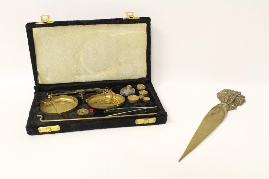 A gold scale & a bronze letter opener (1 of 10)