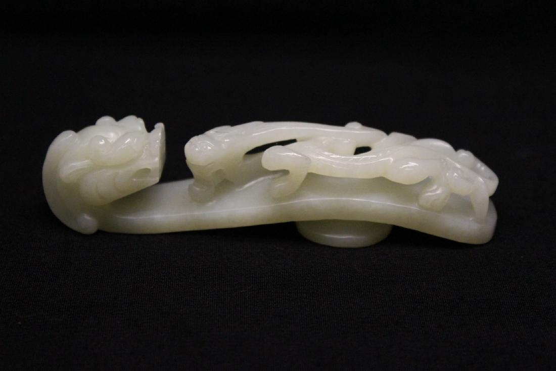 A fine Chinese white jade carved dragon belt buckle (1 of 6)