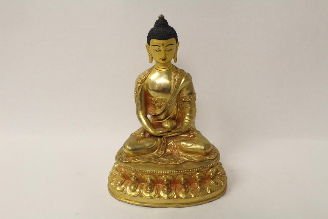 A gilt bronze sculpture of seated Buddha (1 of 10)