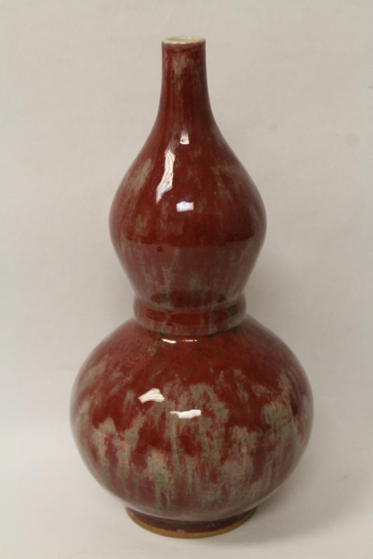Red glazed gourd shape porcelain vase (1 of 10)