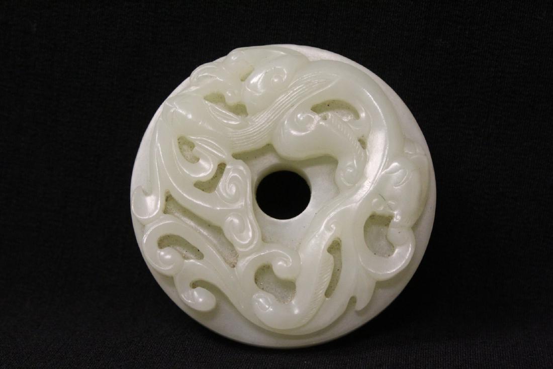Chinese light celadon jade carved disc (1 of 10)