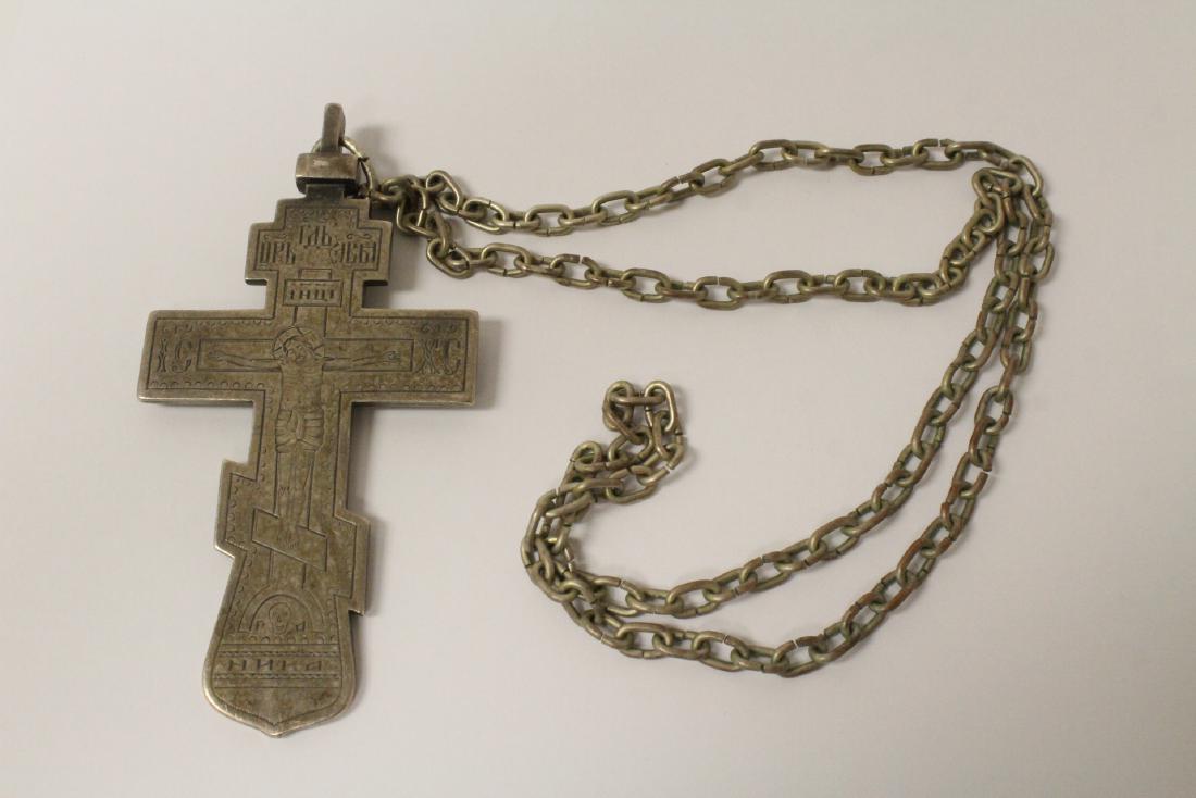 Russian antique silver crucifix with a necklace: An important Russian antique 84 silver crucifix (4.75"x2.65") attached to a necklace (necklace does not test silver), the cross wt. 112gm