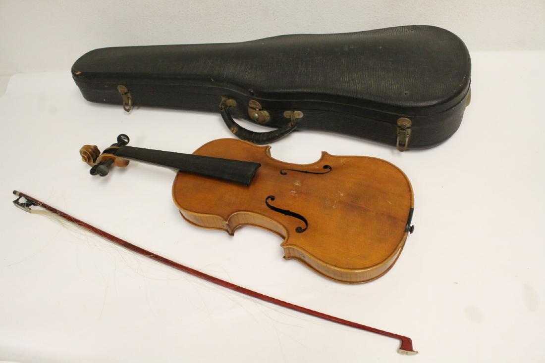 An antique violin with bow: An antique violin with bow