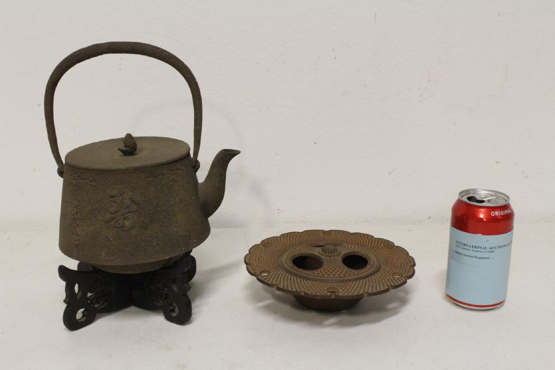 Japanese cast iron teapot and a cast iron censer: Japanese cast iron teapot (9"Hx7.8"x6.2") and a Japanese cast iron censer (2.25"Hx7.45"dia)