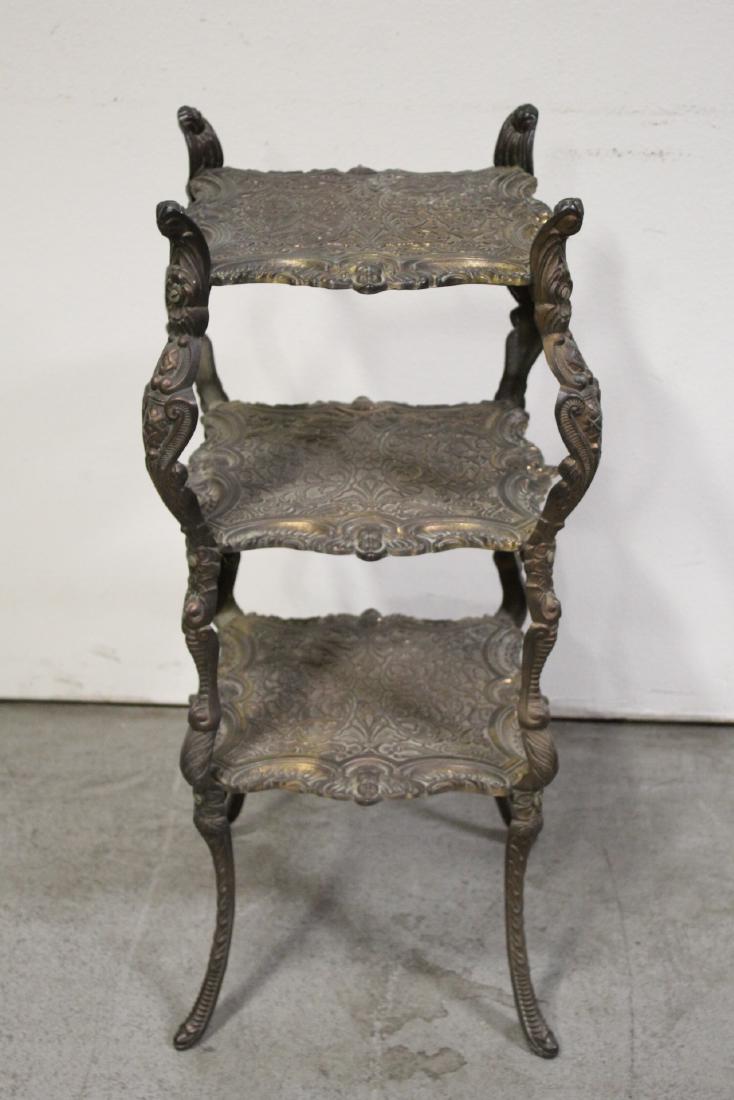 A bronze/copper 3-tier pedestal stand (1 of 10)