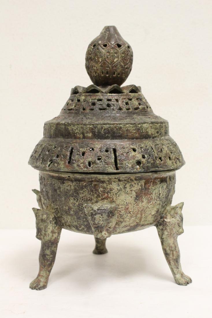 A fine Chinese archaic style bronze tripod censer: A fine Chinese archaic style bronze tripod censer, 12.75"Hx8"dia