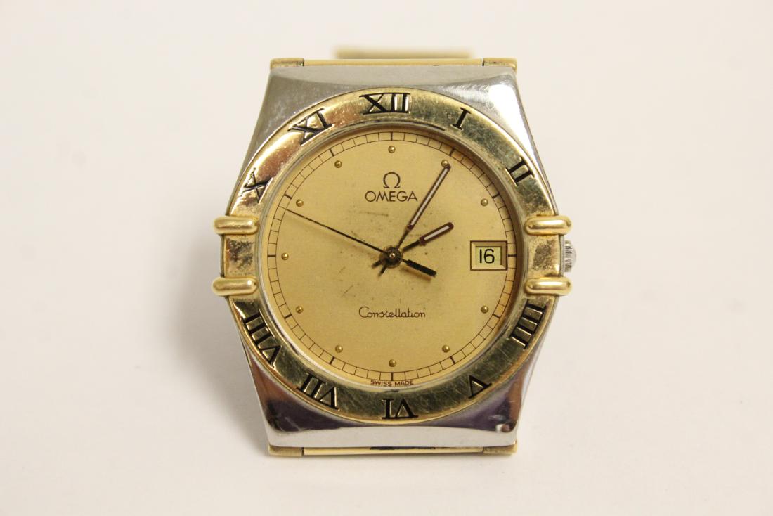 An 18K and stainless steel man's Omega wrist watch (1 of 9)