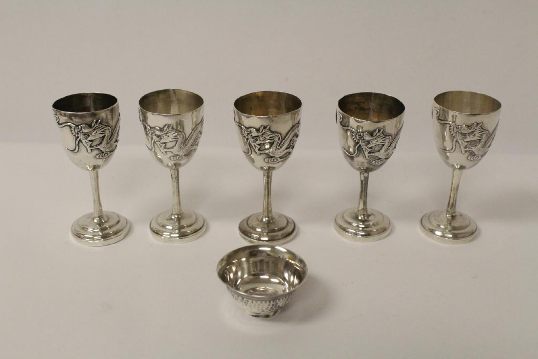 5 Chinese antique export silver wine goblets, & a cup: 5 Chinese antique export silver wine goblets (3.5Hx1.63"dia each) decorated with dragon in relief, and an antique export silver hand hammered wine cup (1"Hx1.95"dia), total wt. 293.3gm