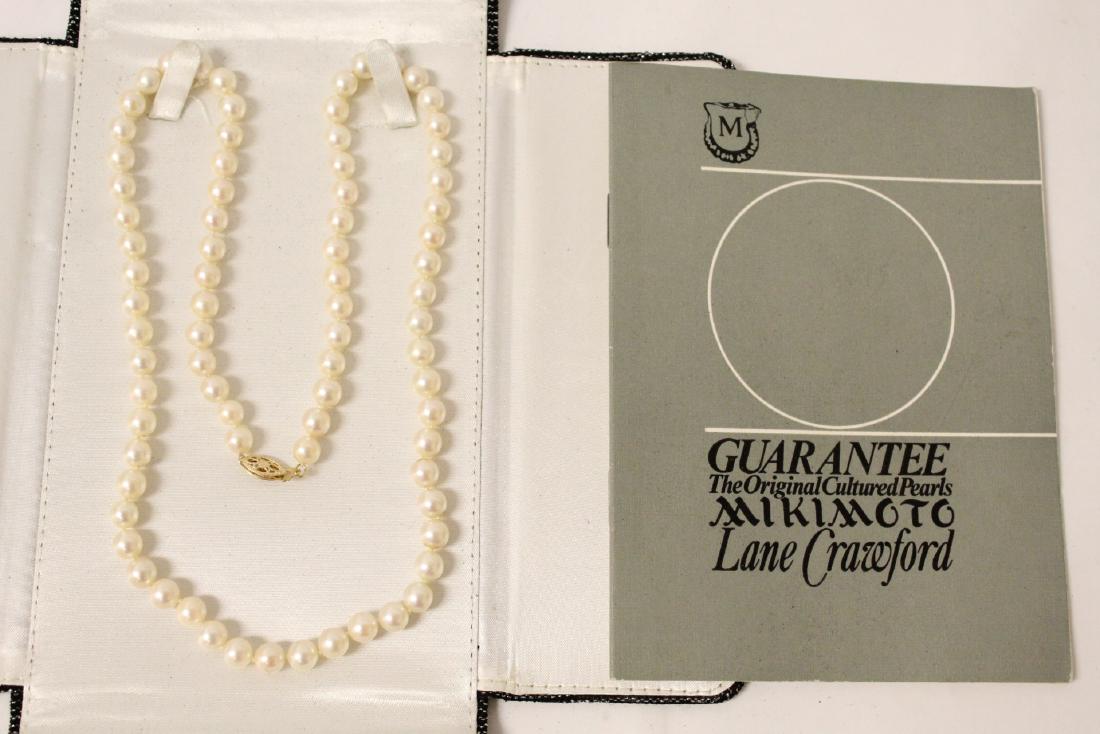 Mikimoto cultured pearl necklace: A fine Mikimoto cultured pearl necklace (22.6"L), each pearl measures 7mm in diameter, the pearls with good luster and match