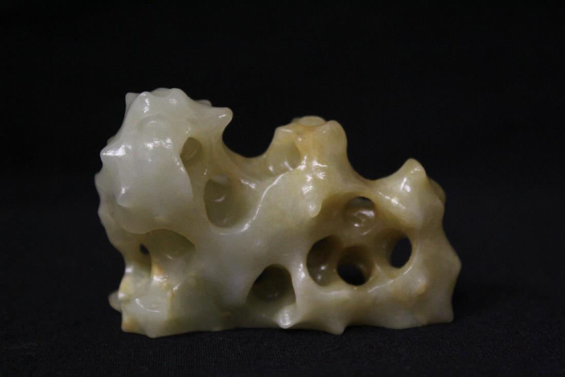 A fine light celadon jade carved brush mountain (1 of 9)