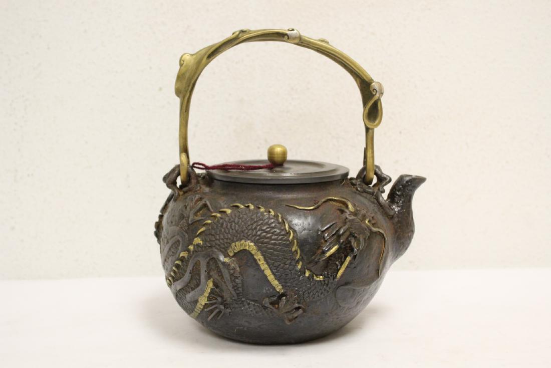 Chinese parcel gilt cast iron teapot: Chinese parcel gilt cast iron teapot, 8.15"Hx7.25"x6"
