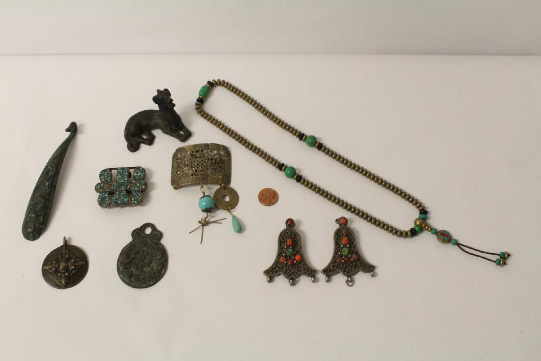 9 piece metal ornaments: 9 piece metal ornaments; including a bronze belt buckle (5.2"L) and a bronze dog (2"H)