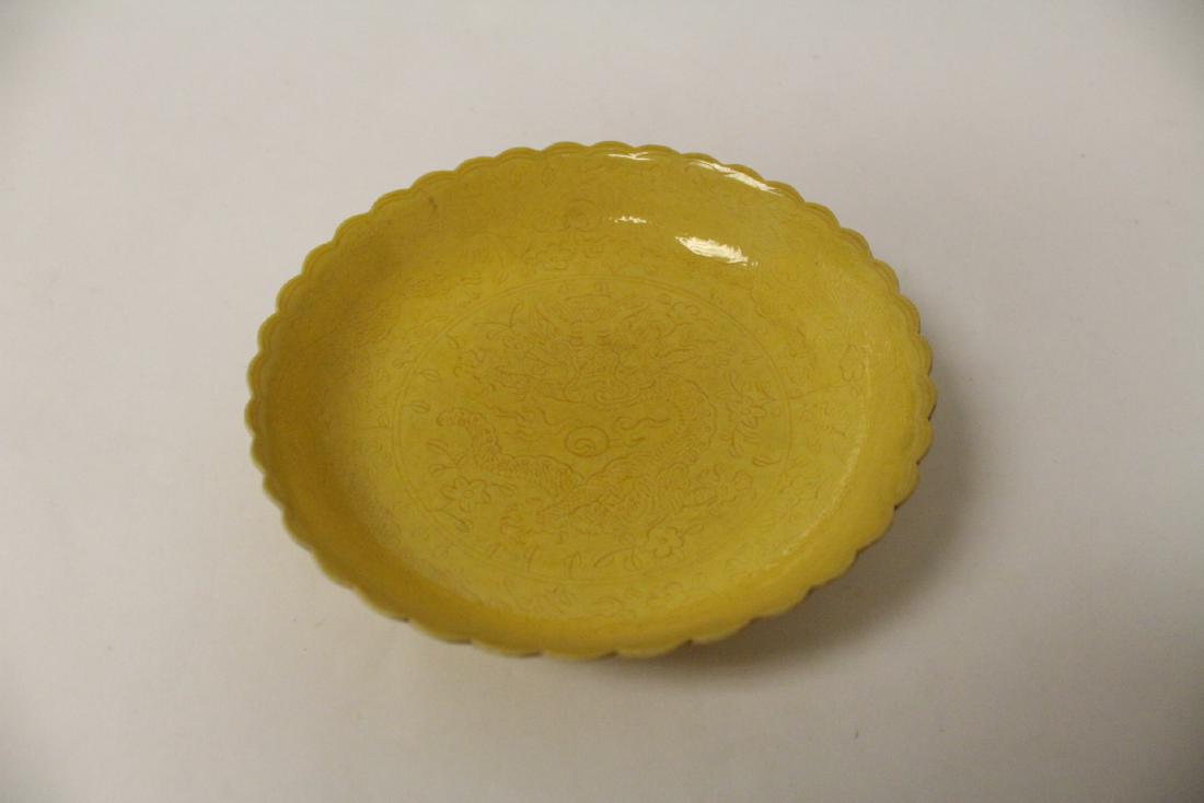 A small yellow glazed plate incised with dragon (1 of 9)