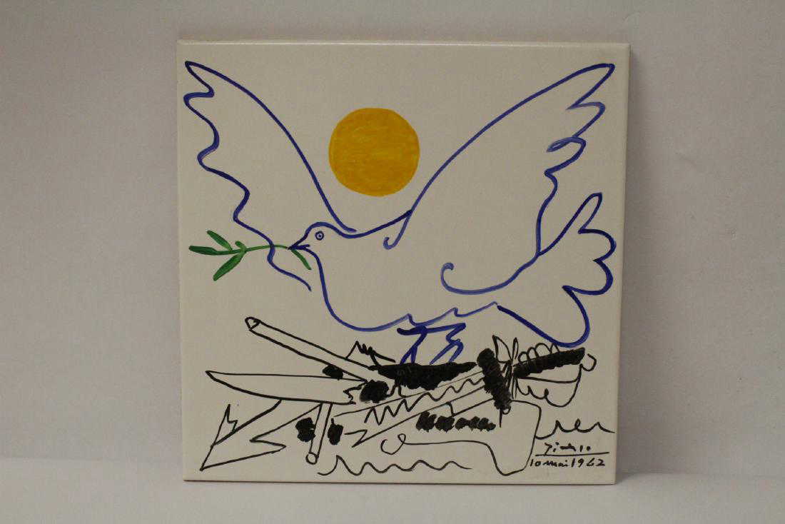 A painted tile, signed Picasso