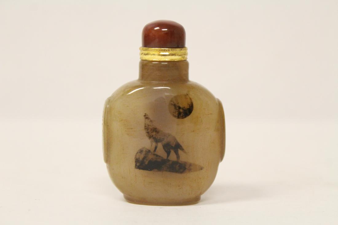 An important Chinese agate snuff bottle: An important Chinese agate snuff bottle, the inclusion mimic a wolf on rock, 2.9"H
