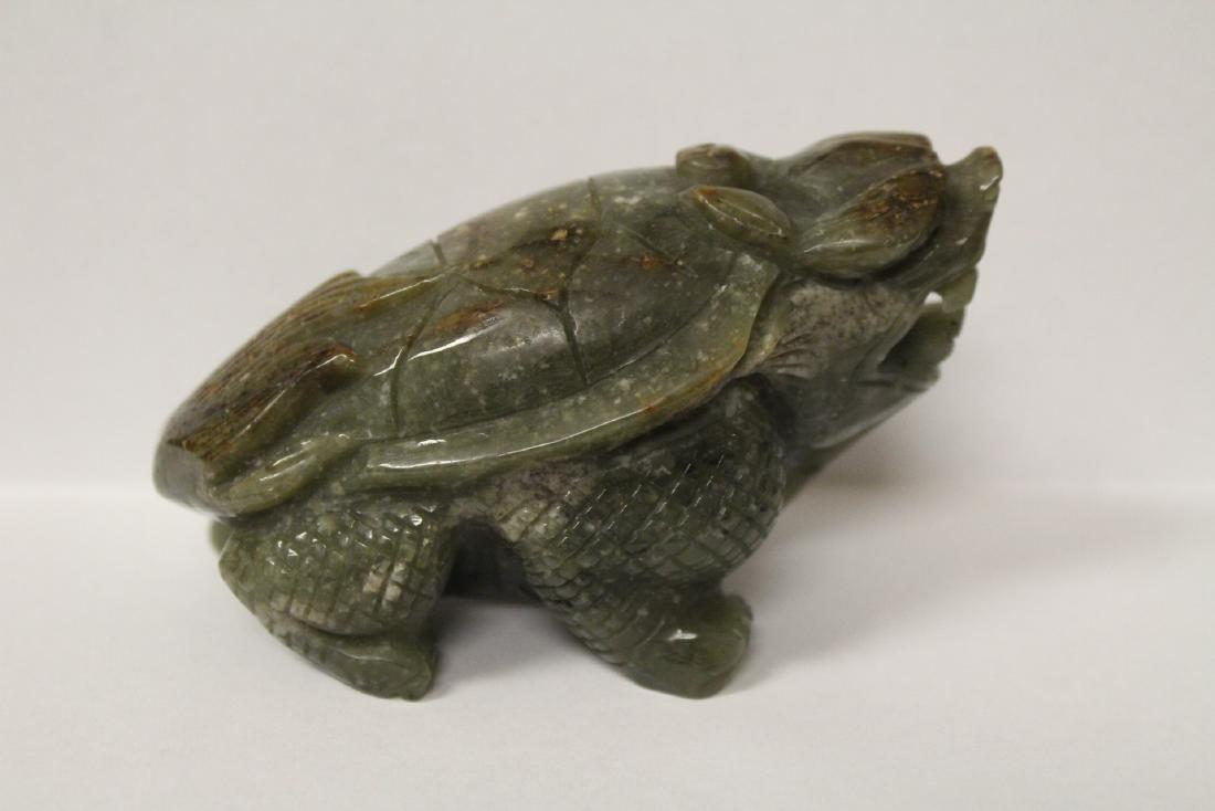 A green jadeite carving depicting frog (1 of 9)