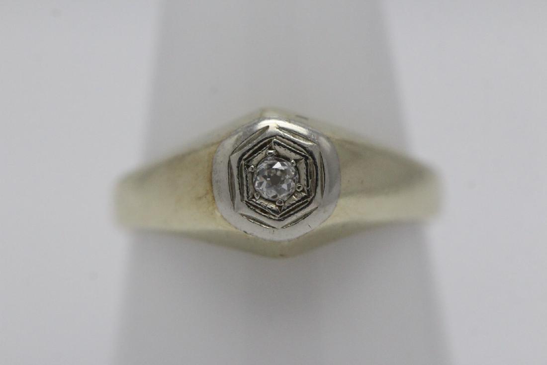 14K Y/G diamond ring: 14K Y/G ring, center an old cut diamond wt. approx. 0.10ct, wt. 4.9gm, size 9