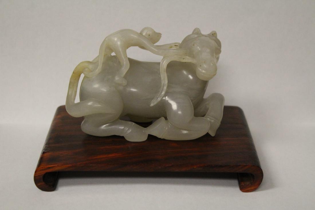 A fine Chinese white jade carving: A fine Chinese white jade carving depicting monkey riding on horse, 2.25"H