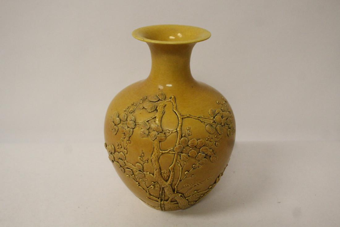 A yellow glazed carved porcelain vase (1 of 9)