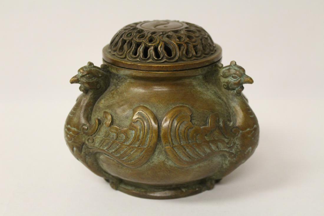 A fancy Chinese bronze censer: A fancy Chinese bronze censer with phoenix motif handles, 4.6"Hx6"dia