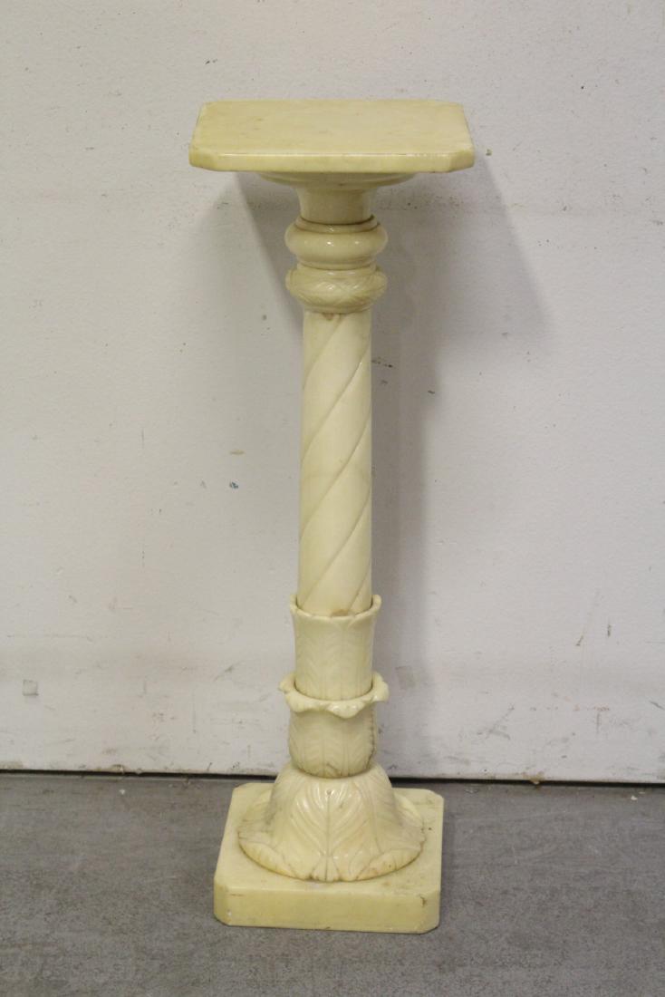 An alabaster pedestal: An alabaster pedestal, 34.25"Hx11"x11"