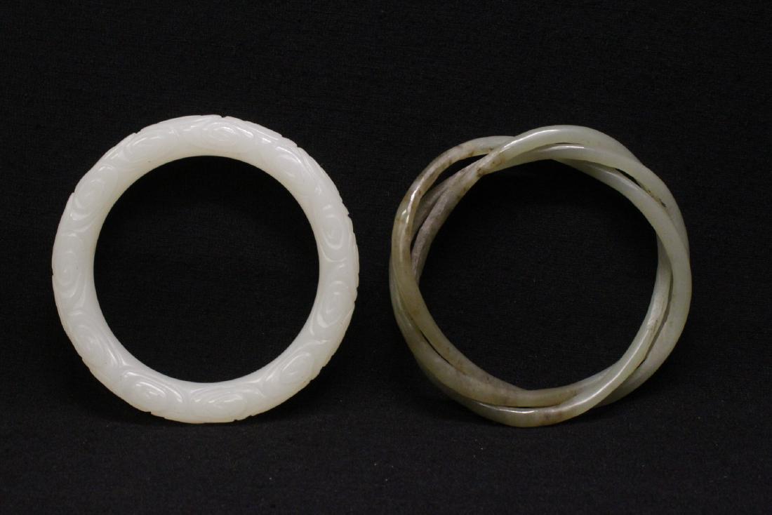 A jade bangle and a Peking glass bangle (1 of 9)