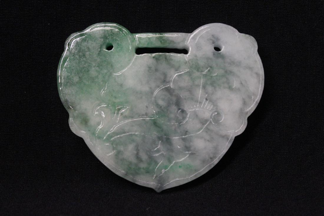 A fine jadeite pendant in lock motif (1 of 10)