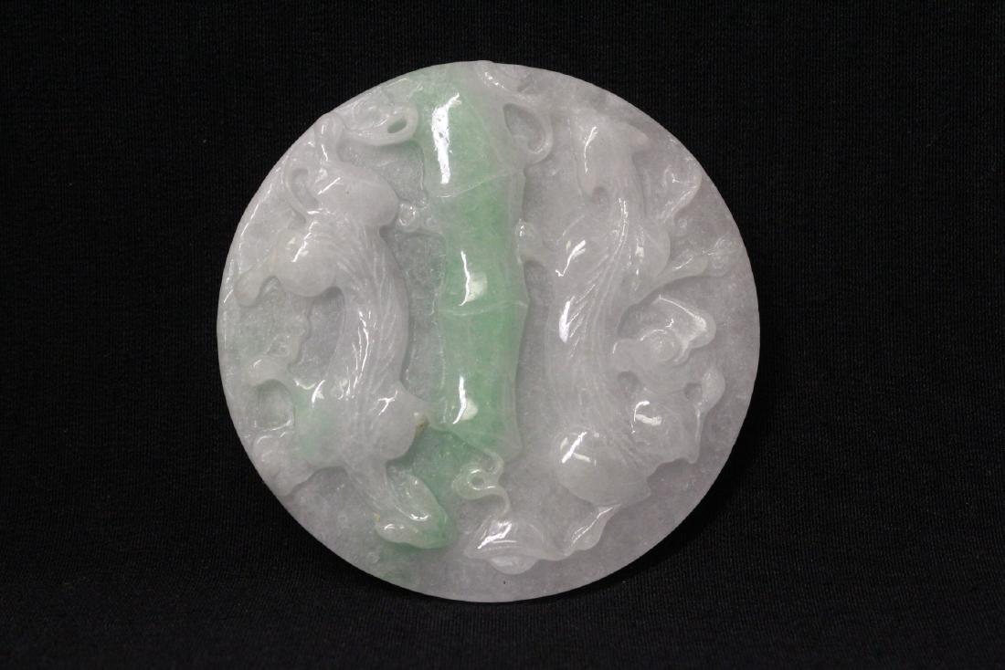 beautiful apple green/ lavender jadeite carved disc: A beautiful apple green/ lavender jadeite carved disc, one side carved with qilin, the other side with phoenix in high relief, 0.48"x2.75"dia