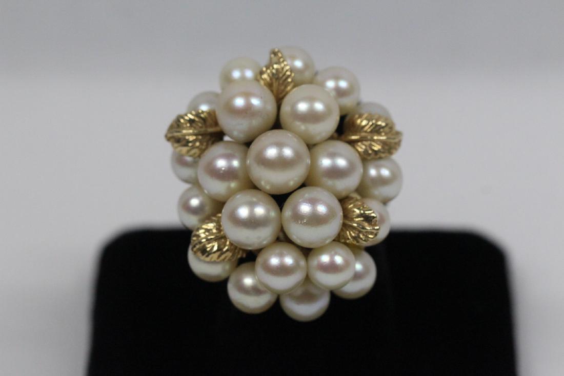 A massive 14K Y/G cultured pearl ring: A massive 14K Y/G cultured pearl ring, cultured pearl measures 7.5 - 6mm diameter, wt. 15gm, size 5.5